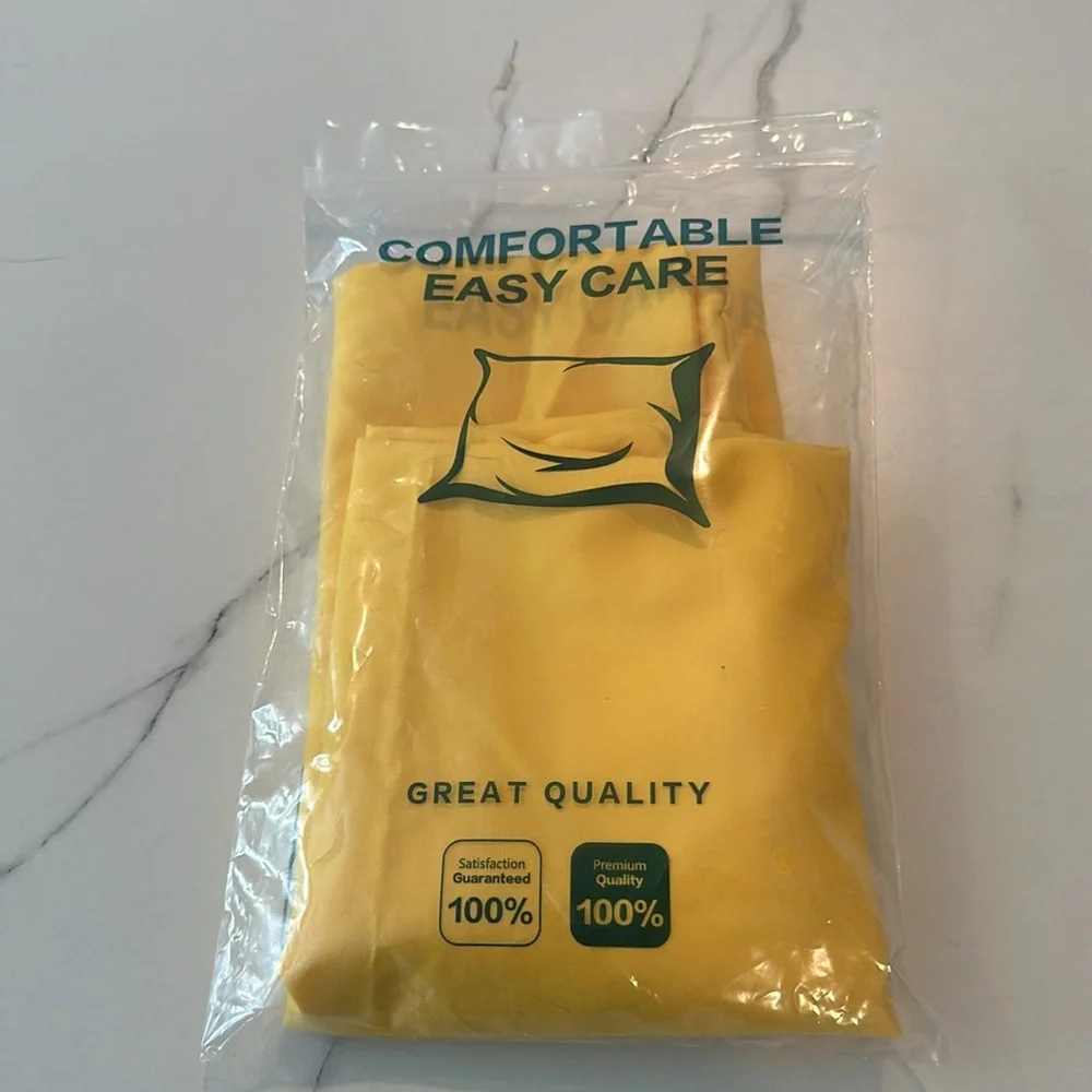 One new in bag yellow queen size pillow case